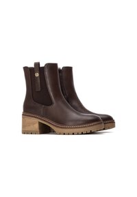 Botas de cuero marrón hasta el tobillo con paneles laterales elásticos, punteras redondeadas y un tacón apilado. Presenta acentos de rayas en color beige en el tacón.