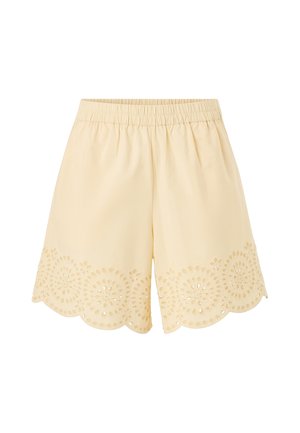 Lysegule shorts med elastisk talje og bølget kant med cirkulært hulmønster.