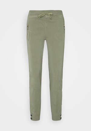 Pantalons de jogging ajustés vert olive avec des poches zippées à l'avant, une taille à cordon de serrage et des poignets boutonnés aux chevilles.