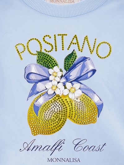 Kék szövet két sárga citrommal, díszítve strasszokkal, zöld levelekkel, fehér virágokkal, lila masnival, és a "Positano Amalfi Coast Monnalisa" felirattal.