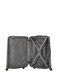 Hard-shell suitcase in muted gray. Interior features a mesh pocket and cross-straps for securing items. Smooth black wheels for mobility.
