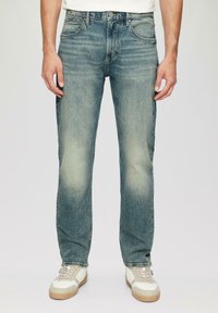 Lichtblauwe denim jeans met een rechte pasvorm, vervaagde afwerking, vijf-pocket ontwerp, metalen knoopsluiting en subtiele whiskering details.