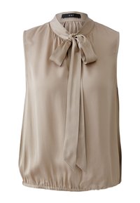 Ärmellose Bluse in Beige, aus glattem Stoff gefertigt. Verfügt über einen hohen Halsausschnitt mit einer Schnürung und einem elastischen Saum. Einfaches und elegantes Design.