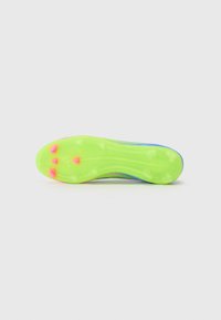 Bright green cleat sole with pink accents, featuring multiple studs for traction, smooth textured surface, and a contoured design.