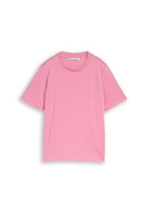 T-shirt uni rose à manches courtes et col rond, posé à plat avec l'étiquette de col visible.