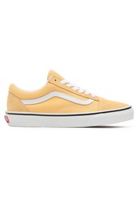 Yellow canvas sneakers with white laces and side stripe, featuring a black rubber outsole and textured toe cap. Red logo on heel.