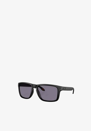 Black plastic sunglasses with a rectangular frame, grey tinted lenses, subtle logos on the sides, and metallic accents.
