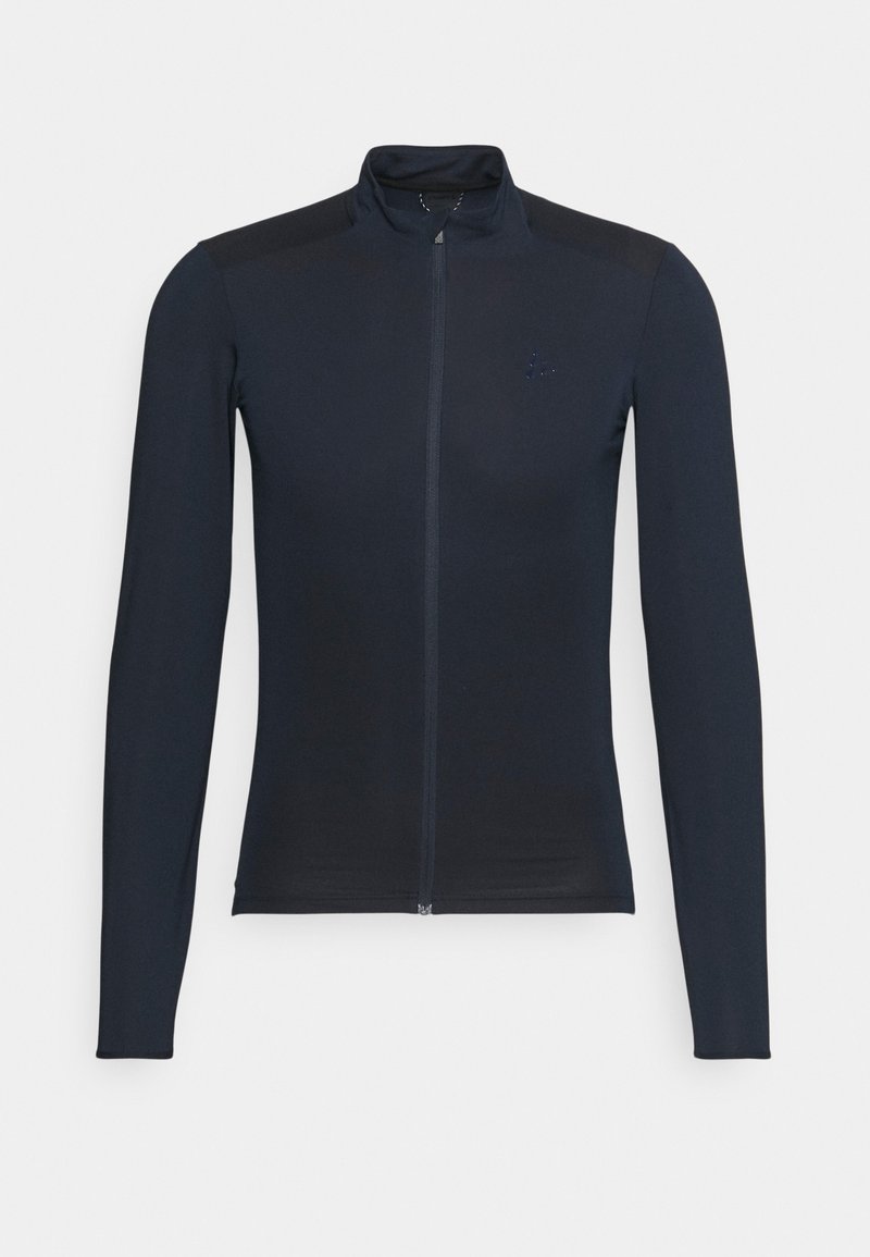 Veste noire cintrée à manches longues avec fermeture éclair complète à l'avant et col montant, affichée sur un fond gris clair.