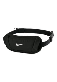 Black waist bag made of durable fabric with adjustable strap. Features a zippered front pocket and a white Nike logo on the surface.