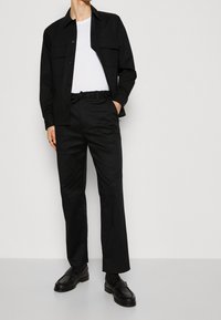 Calvin Klein Trousers - black