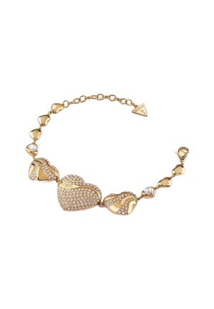 Bransoletka w złotym kolorze z serduszkowymi zawieszkami, niektóre wysadzone przezroczystymi cyrkoniami, ozdobiona gładkimi i teksturowanymi akcentami.