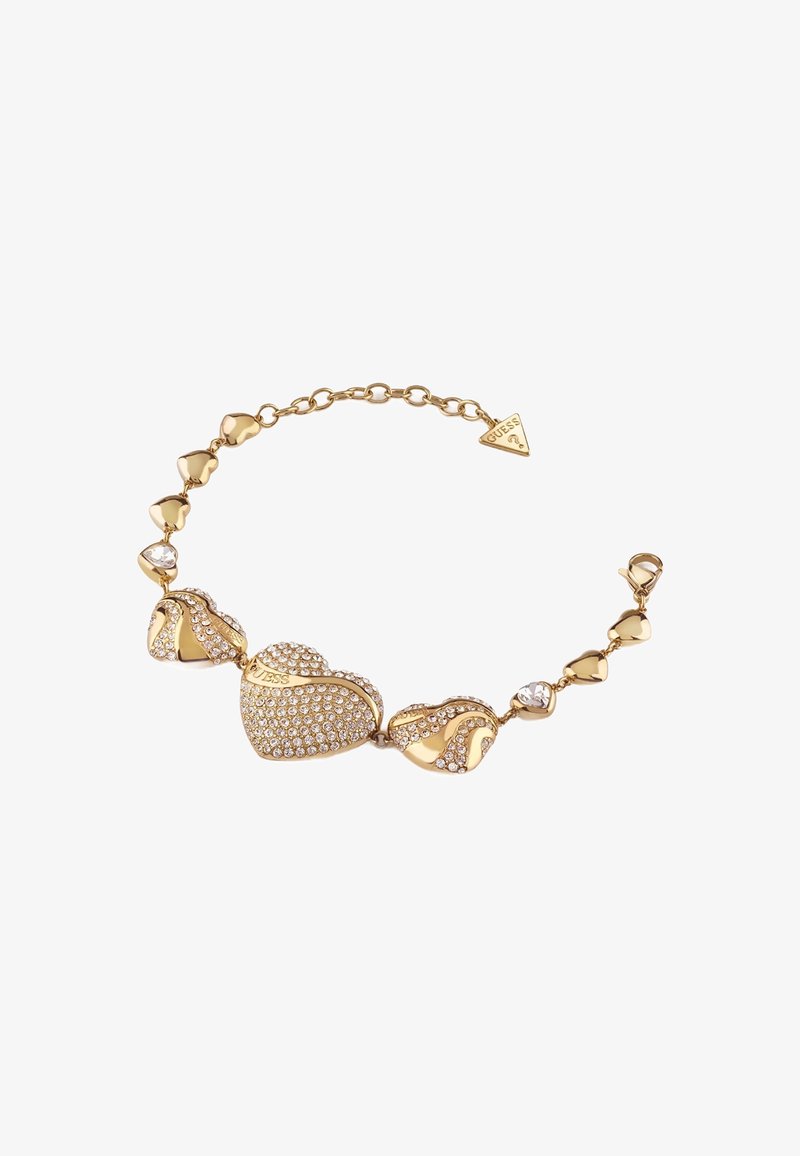 Bracelet en ton or featuring des charms en forme de cœur, certains ornés de strass transparents, embellis d'accents lisses et texturés.