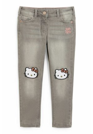Grå børnejegins med Hello Kitty-ansigtspatches på knæene og lyserød "Hello Kitty" broderi på frontlommen.