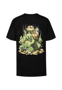 T-shirt en coton noir présentant un graphisme coloré de succulentes et de cactus, avec le texte "BAJA CALIFORNIA MX" affiché en évidence.