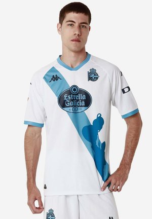 Maglia da football bianca a maniche corte con una striscia diagonale blu, logo nero e accenti artistici. Realizzata in tessuto leggero.