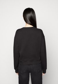 Guess CRYSTAL MESH  - Sudadera - jet black