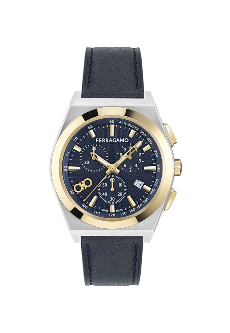 Reloj cronógrafo con una esfera azul marino, acentos en tono dorado, caja de acero inoxidable y correa de piel azul oscura. Cuenta con tres subesferas y un indicador de fecha.
