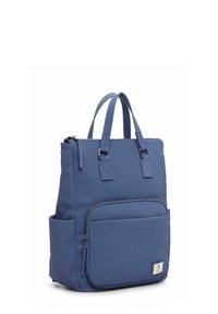 Blue fabric backpack with two top handles, zip closure, front pocket, and vertical ribbed texture. Features a small logo tag.