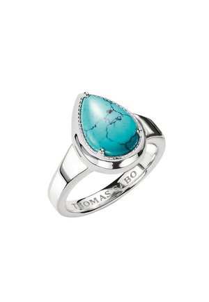 Silver ring with pear-shaped turquoise stone featuring natural black veining, engraved with "THOMAS SABO" on the band interior.
