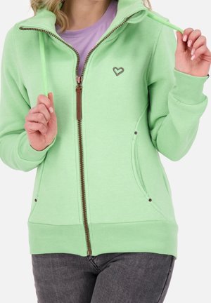 Felpa zip-up verde menta con colletto alto, zipper marrone, due tasche laterali e logo a forma di cuore sul petto. Materiale misto cotone.