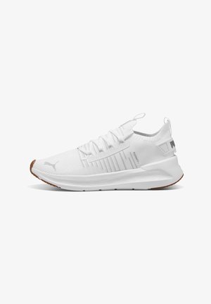 White low-top athletic sneaker with knit upper, lace closure, thick sole, and subtle branding on the side and heel tab.