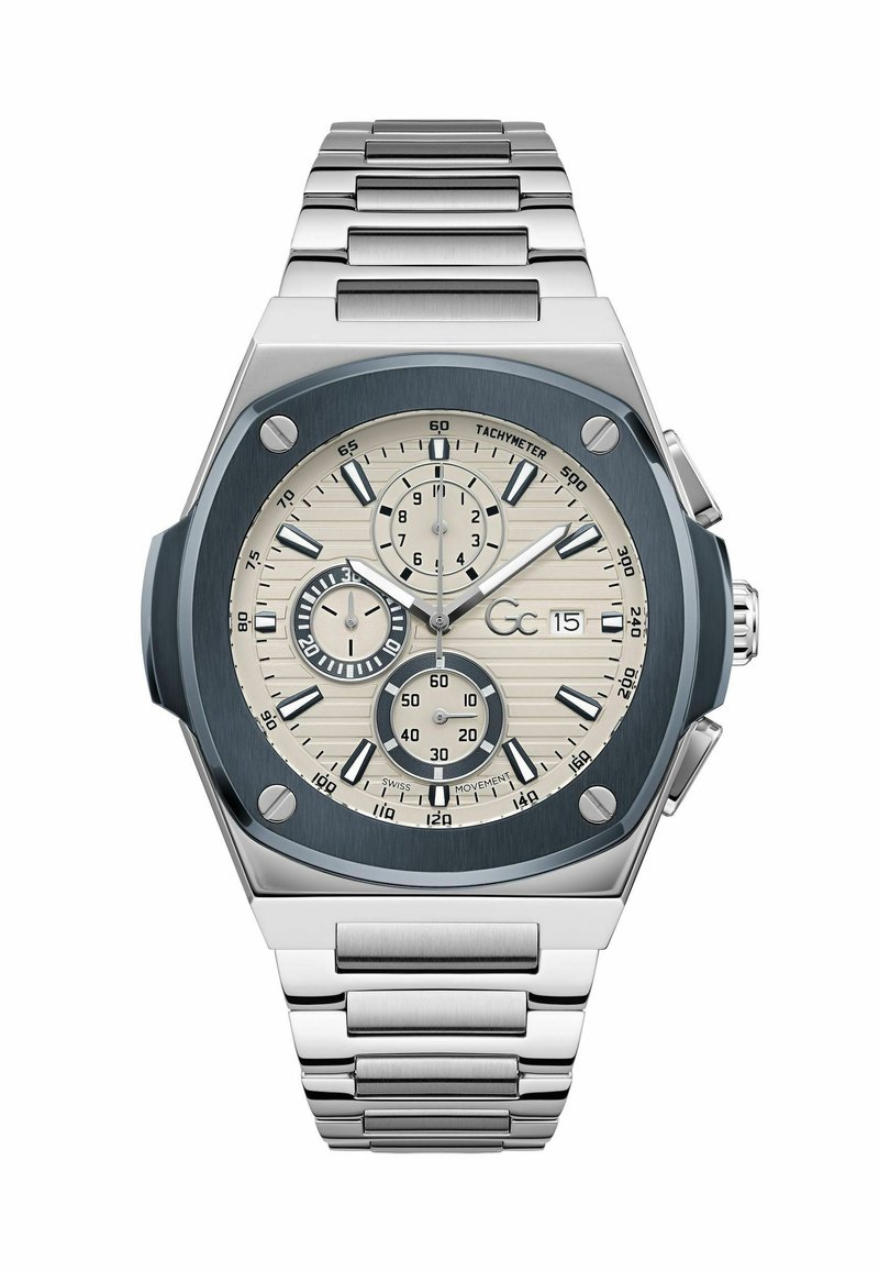Silverfärgad rostfri stålur med oktagonal klockkapsel, blå urtavla, texturerade beige timmarkörer och chronografunderdialer. Metallarmbandslänk.