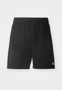 Short noir décontracté avec ceinture élastique et cordon, avec un petit logo blanc près de l'ourlet en bas côté gauche.