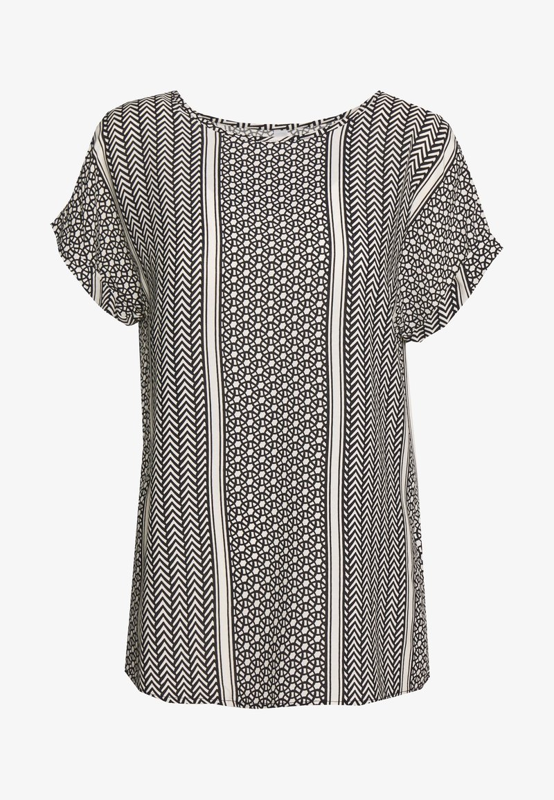 Blouse à manches courtes noire et blanche avec des motifs géométriques verticaux incluant des chevrons et des formes circulaires.