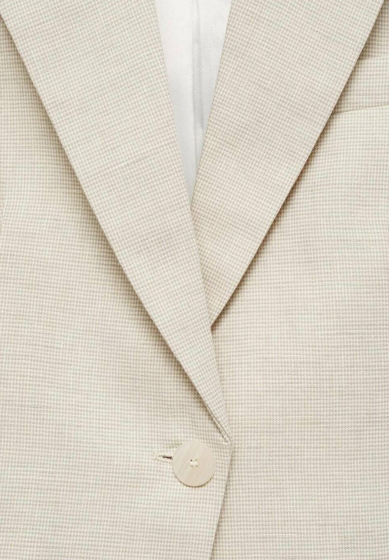 Beige Blazer mit dezentem Karomuster, Reverskragen und einer runden Knopfverschluss vorne. Glatte Stofftextur.