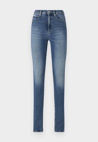Skinny-fit jeans made from denim, featuring a medium wash, high waist, classic five-pocket design, and subtle fading on the thighs.