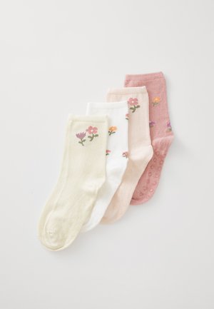 Quatre paires de chaussettes dans des couleurs pastel : vert, blanc, rose et rose clair, avec une broderie florale et des points texturés sur les semelles.
