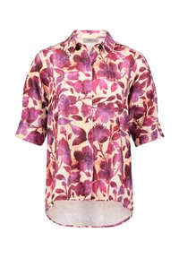 Krótki rękaw bluzka w kwiaty w kolorze kremowym, z dużymi fioletowymi i różowymi kwiatami, zapinana na guziki z przodu, oraz zaokrąglonym dołem o luźnym kroju.