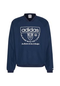 Mörkblå långärmad sweatshirt med rundad halsringning. Har en vit logotyp och text, med ribbade manschetter och fåll. Tillverkad av slät, strukturerad tyg.