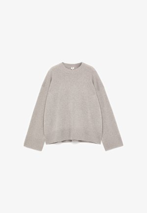 Gray knitted sweater with a crew neck, dropped shoulders, and ribbed cuffs and hem. Features a relaxed fit and soft texture.