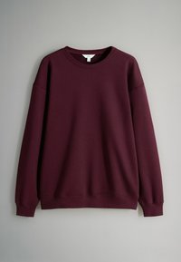 Burgundowa bluza z okrągłym dekoltem, długimi rękawami i ściągaczami przy rękawach i dole, charakteryzująca się miękką, gładką fakturą. Brak widocznych wzorów.
