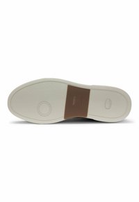 White rubber shoe outsole with a textured surface, featuring a brown accent and circular logo detail. Smooth edges and rounded shape.