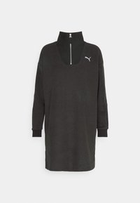 Zwart sweatshirtjurk met een hoge kraag, ritssluiting aan de voorkant, lange mouwen en een losse pasvorm. Beschikt over een klein wit logo op de borst.