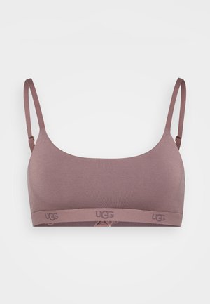 Trådløs bralette i mauve med tynde stropper og en logobånd. Glat tekstur, sømløst design, uden bøjle, ideel til komfort.