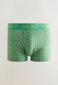 Modri in zeleni boxer šortki z vzorcem, ki imajo zeleni pas z zlatim logotipom "NEXT". Narejeni so iz raztegljivega materiala in imajo oprijet kroj.