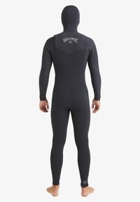 Black wetsuit with long sleeves and hood, featuring contrasting stitching and a logo on the back. Smooth texture, fitted design.