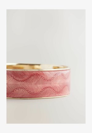 Pink bangle featuring a wavy pattern and gold-tone edge, crafted from smooth material with a glossy finish.