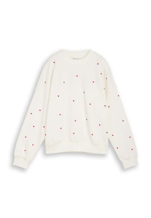 Λευκό φούτερ με μακριά μανίκια, διακοσμημένο με μικρά κόκκινα σχέδια καρδιάς διασκορπισμένα στο μπροστινό μέρος και στα μανίκια, με ριμπ μανσέτες και τελείωμα.