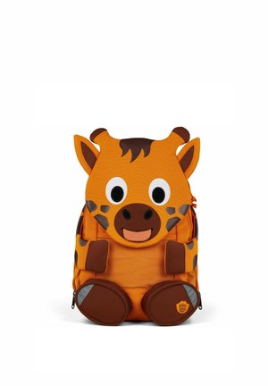 Orange backpack shaped like a giraffe, with patterned fabric, large eyes, brown accents, and plush feet. Zipper pockets at sides.