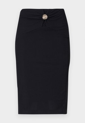 Black pencil skirt with a fitted design, featuring a twisted front detail and a round gold button accent at the waist. Smooth fabric texture.
