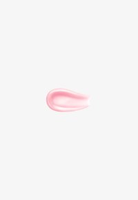Tache de crème rose brillante sur fond blanc, montrant une texture lisse et de la brillance.