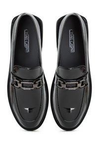Black patent leather loafers with a square toe, featuring a decorative chain accent across the midfoot and a smooth, glossy finish.