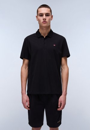 Black polo shirt made of cotton, featuring a three-button placket and a small logo on the left chest. Short sleeves, relaxed fit.