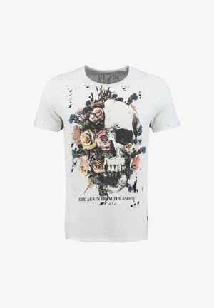 Biała koszulka z grafiką przedstawiającą pół czaszki, pół bukiet kwiatów oraz napisem "Wstań ponownie z popiołów" na dole.