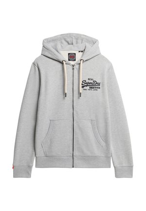 Lichtgrijze rits-hoodie met een voorzak, trekkoordkap en geborduurde branding. Zachte stof met ribbel manchetten en zoom.