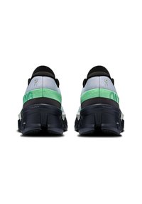 Black and green running shoes with a mesh upper, featuring a textured rubber sole, cushioned heel, and logo on the back.